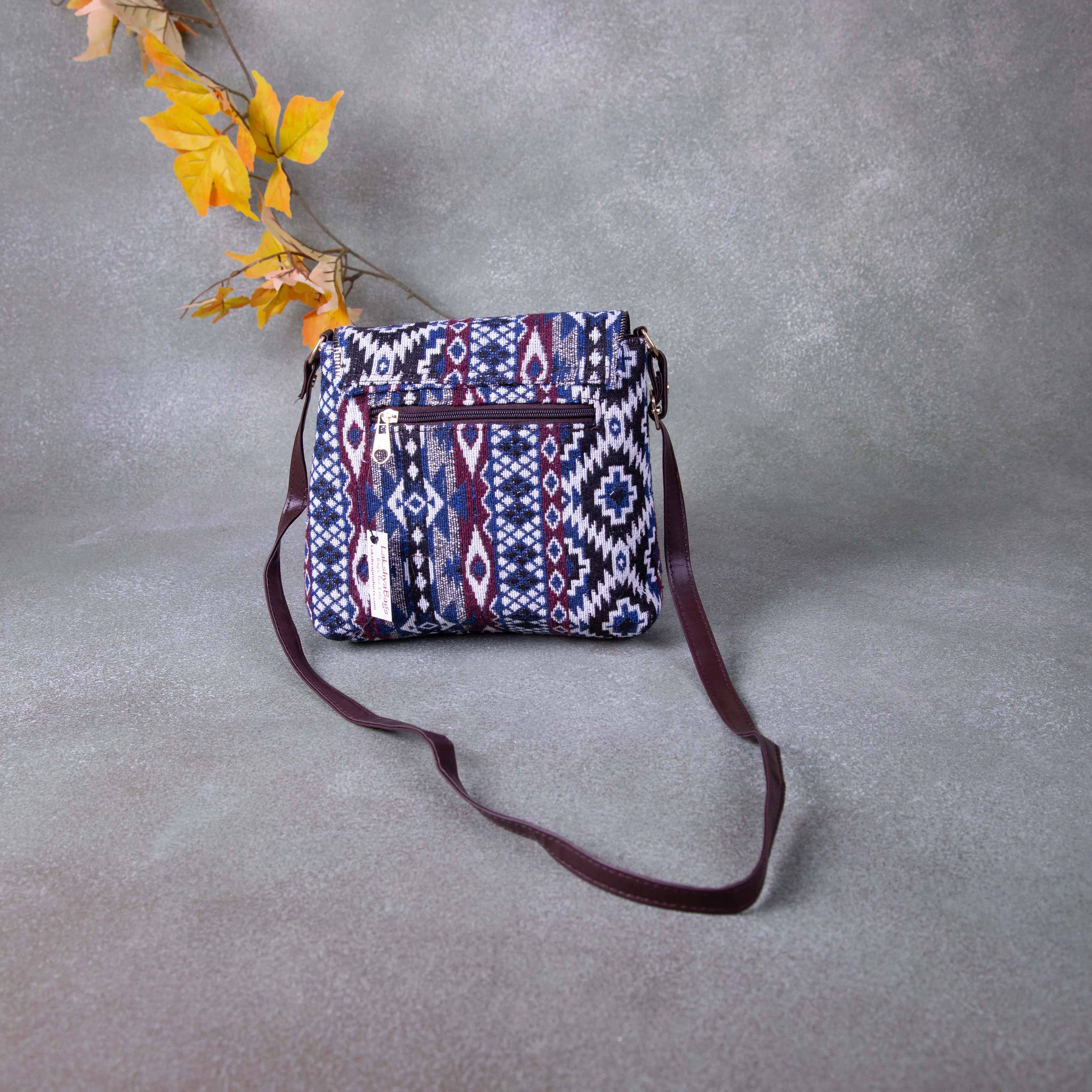 Regular Slings Blue with Maroon Colour Round Flap Design.